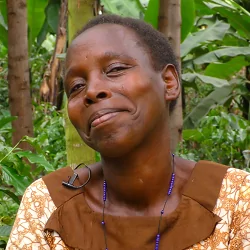In 2012, Oliva became a participant of Ecotrust Uganda’s Trees for Global Benefits project. She lives in the Maliba community of Western Uganda’s Kasese district, and she’s planted 400 trees which are sequestering an estimated 203.4 tonnes of CO2.

Oliva is projected to earn $610.40 from TGB. In this interview, you’ll learn how she uses those earnings, as well as about her children and grandchildren, one of her favorite ways to relax, what “MIFA” stands for, how she lost some of her trees, and how her community views firewood thieves!